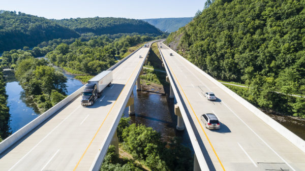 Vehicles driving across bridge on highway