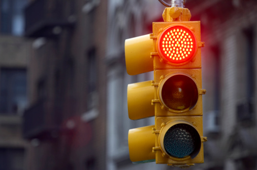 A traffic signal showing red for stop