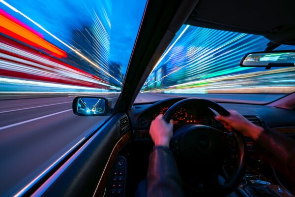 Speeding car at night in city